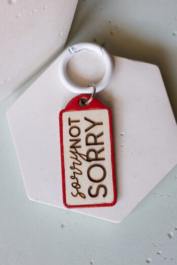 Keychain red "Sorry not sorry"